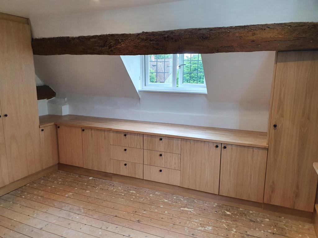 Oak joinery in bedroom.